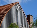 Top van de westgevel met schoorsteen.
              <br/>
              Gert-Jan Lobbes, 2024