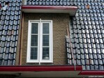 Trappenhuisraam rechter woning.
<br/>
Gert-Jan Lobbes, 2023