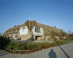 Het aanzicht van de school na herstel.
              <br/>
              Utrechts Archief, Fotodienst GAU fotograaf, 1990