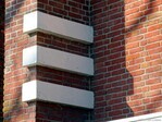 Betonnen versieringen aan de basis van de schoorsteen.
<br/>
Gert-Jan Lobbes, 2024