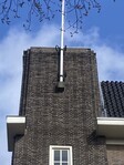 Vlaggemast en smeedijzer boven entree.
<br/>
Erik de Groot, 2026